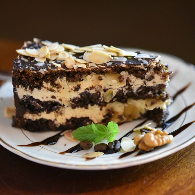 A piece of cake sitting on a white plate